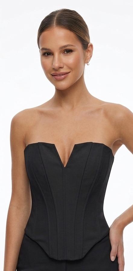 Il bustier avorio/nero che eleva ogni look.